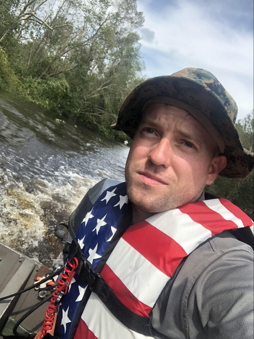 Ryan Nichols pulling a stranded family out of hurricane floodwaters