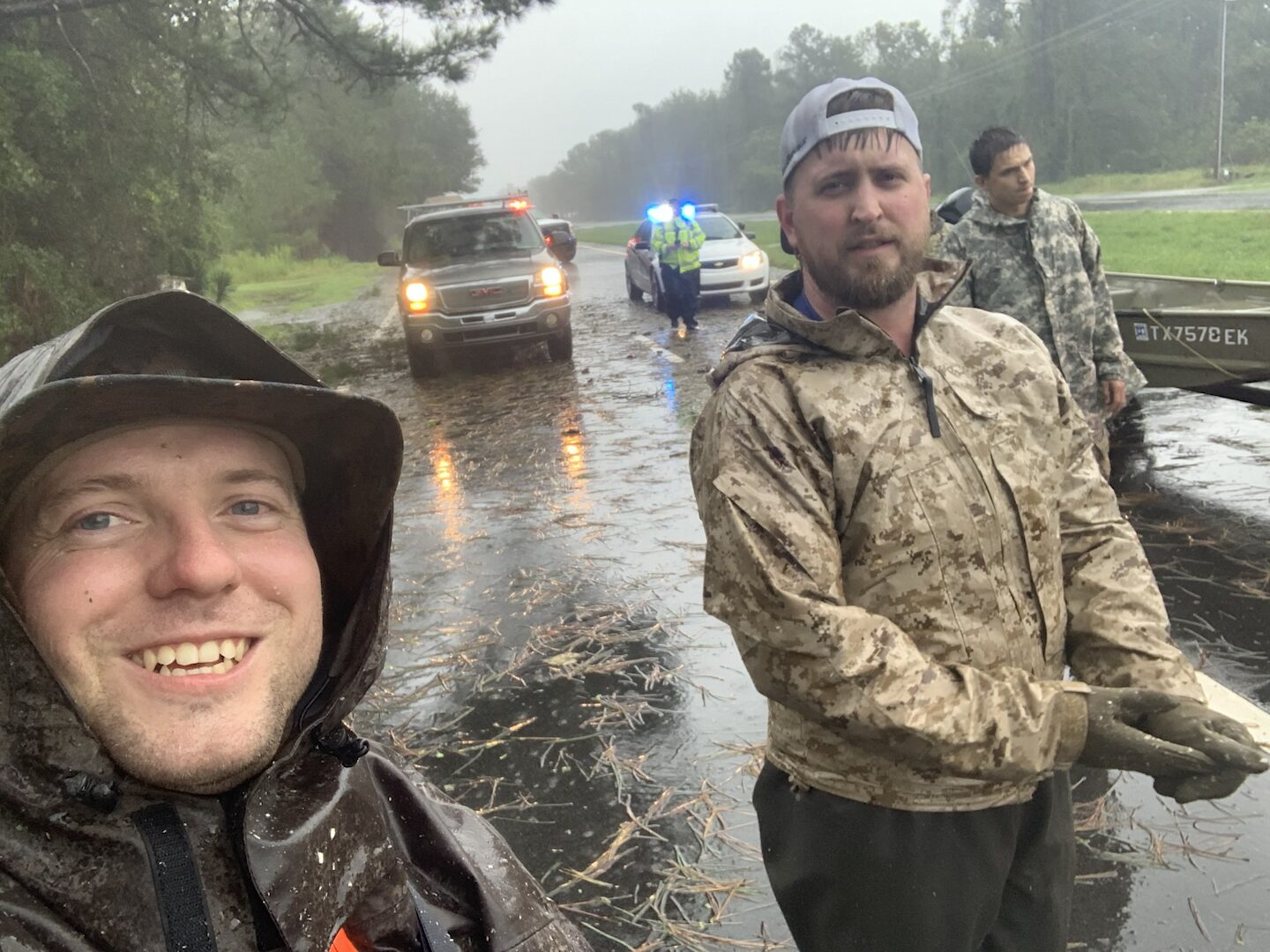 Ryan Nichols wading through floodwater on a search-and-rescue operation
