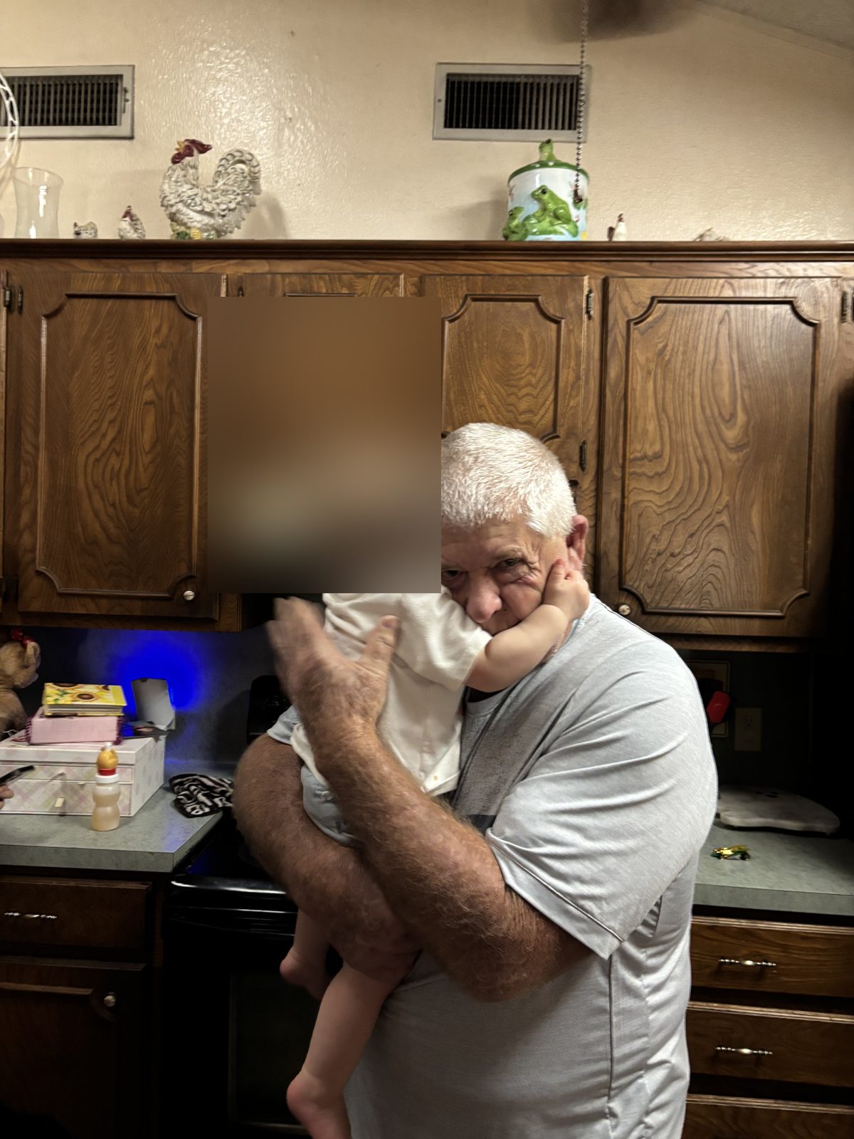 Lynn Tress holding the baby the family says they have been cut off from